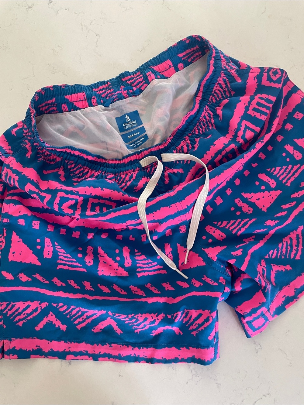 chubbies Tide Pool Neon Pink and Navy Aztec Swim Trunks